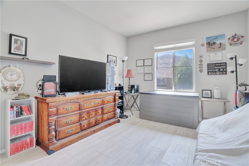 12179 Dewar Drive Riverside, CA 92505 - Photo 25 of 53 a living room with furniture and a flat screen tv