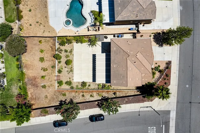 an aerial view of residential houses with outdoor space