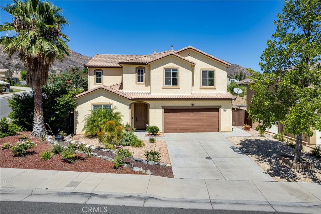 12179 Dewar Drive Riverside, CA 92505 - Photo 53 of 53 a front view of a house with a garden