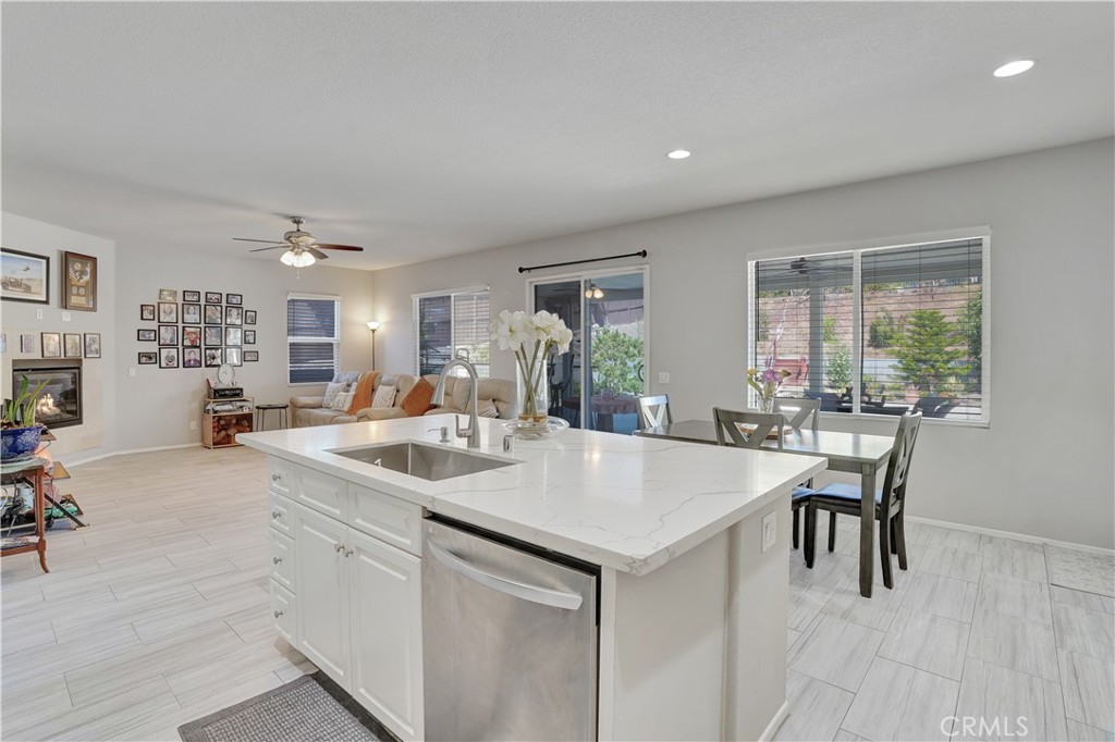 12179 Dewar Drive Riverside, CA 92505 - Photo 8 of 53 a view of kitchen island a sink and living room