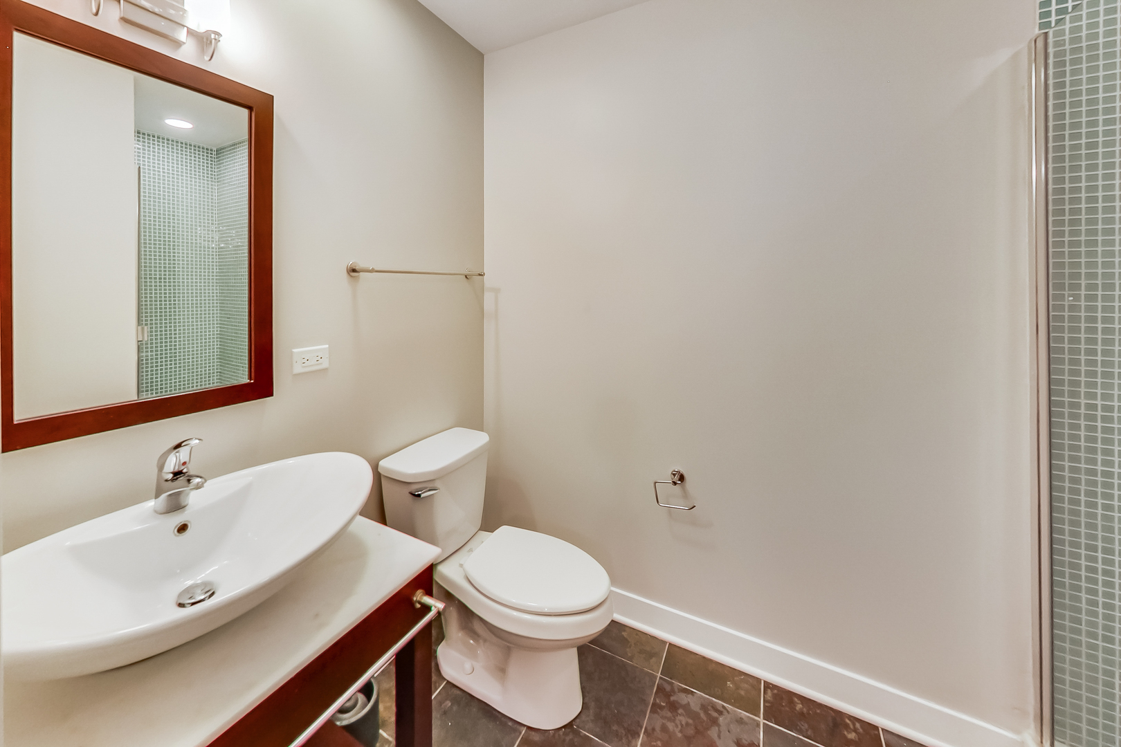 650 West Wayman Street, Unit 503C Chicago, IL 60661 - Photo 11 of 23 a bathroom with a sink a toilet and mirror
