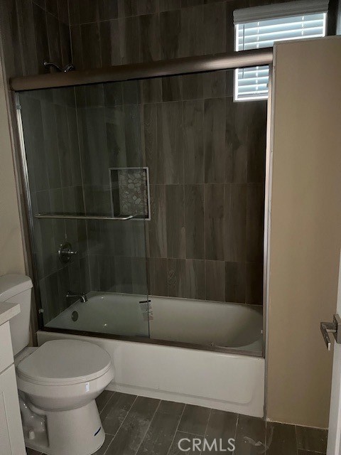 4855 Grace Avenue Cypress, CA 90630 - Photo 12 of 15 a bathroom with a shower and a toilet