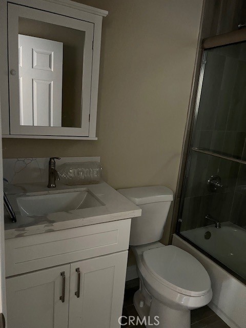4855 Grace Avenue Cypress, CA 90630 - Photo 13 of 15 a bathroom with a toilet sink and mirror