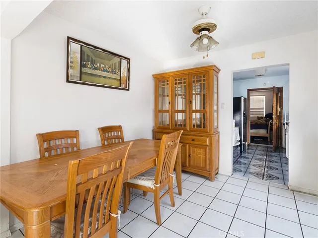 a dining room with furniture and a chandelier