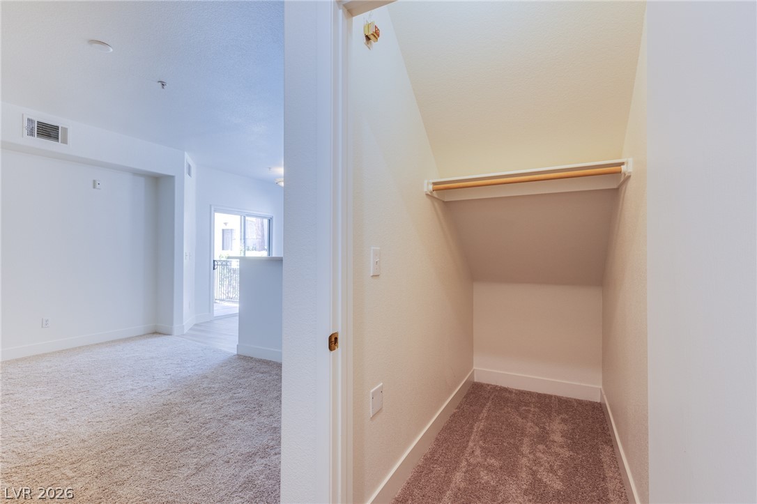 9050 West Warm Springs Road, Unit 1011 Las Vegas, NV 89148 - Photo 9 of 32 A well-lit interior offers ample space and a cozy closet nook.