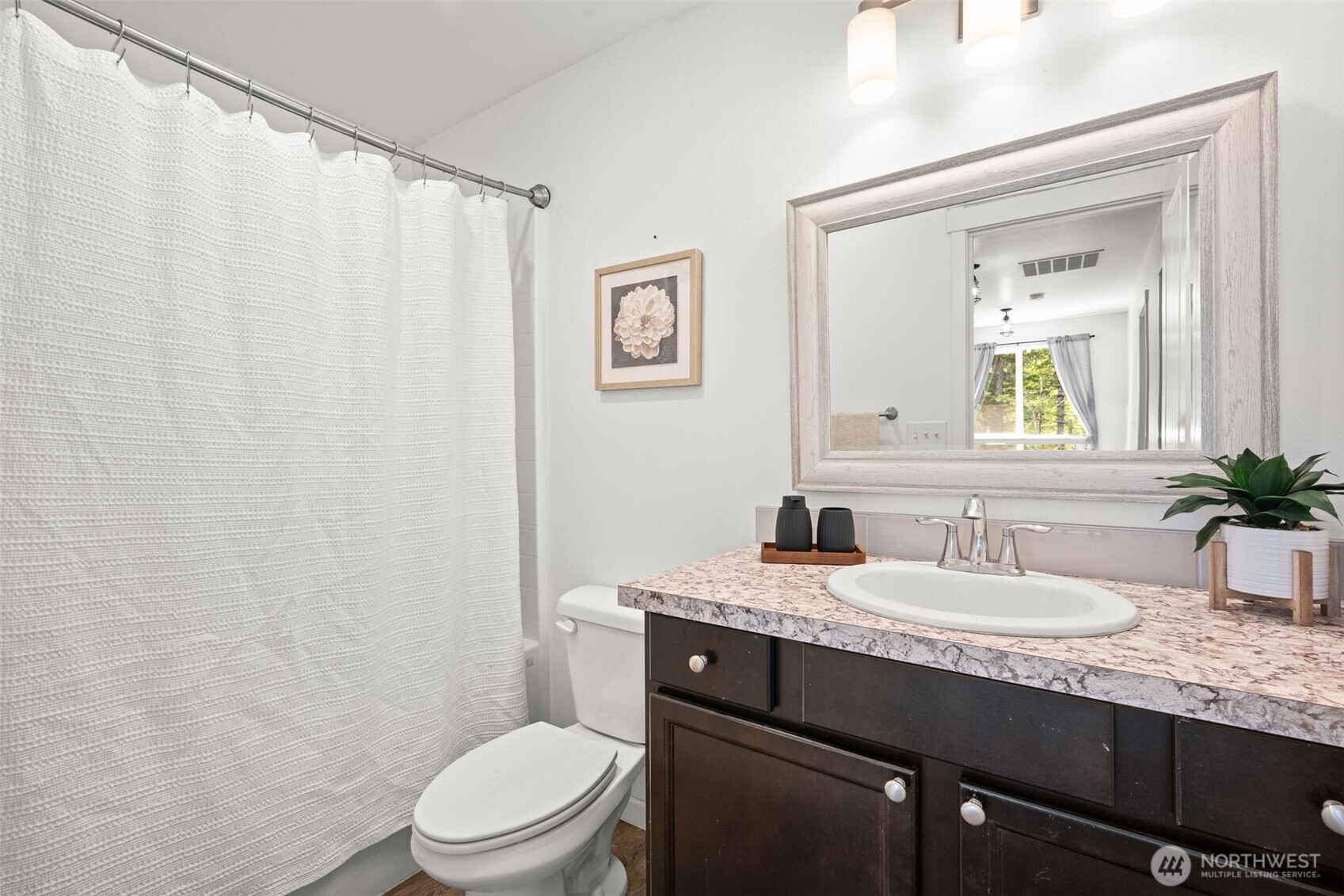 401 East Sunset Ridge Road Union, WA 98592 - Photo 20 of 37 a bathroom with a granite countertop sink mirror vanity and toilet