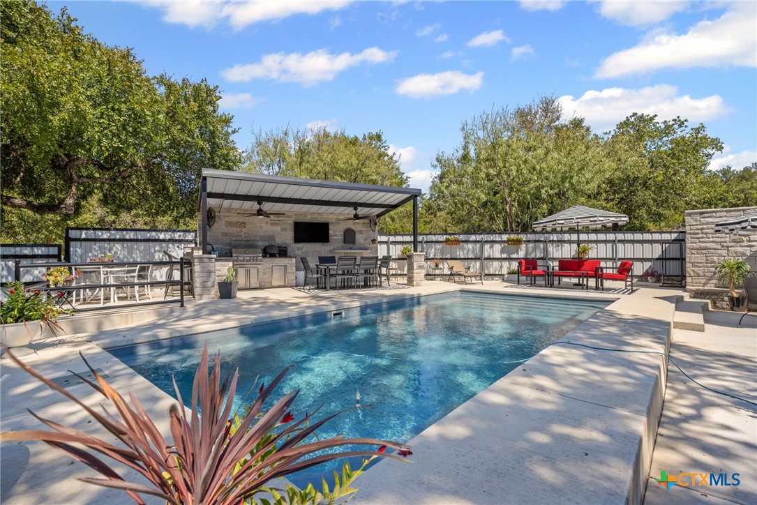 28099 Fm 2670 Killeen, TX 76549 - Photo 34 of 48 a view of a swimming pool with a deck and a sitting space