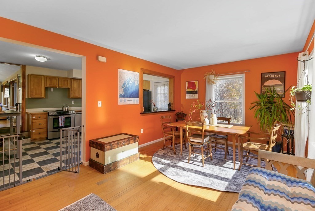27 Locke Road Rutland, MA 01543 - Photo 13 of 39 a living room with furniture a rug kitchen view and large windows