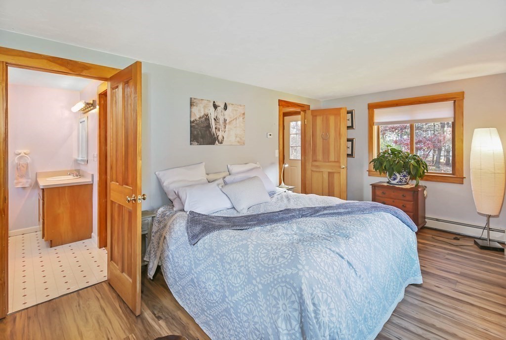 27 Locke Road Rutland, MA 01543 - Photo 16 of 39 a spacious bedroom with a bed and a large window