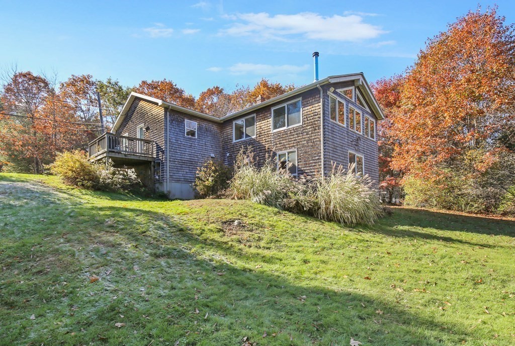 27 Locke Road Rutland, MA 01543 - Photo 27 of 39 a view of a house with a yard and plants