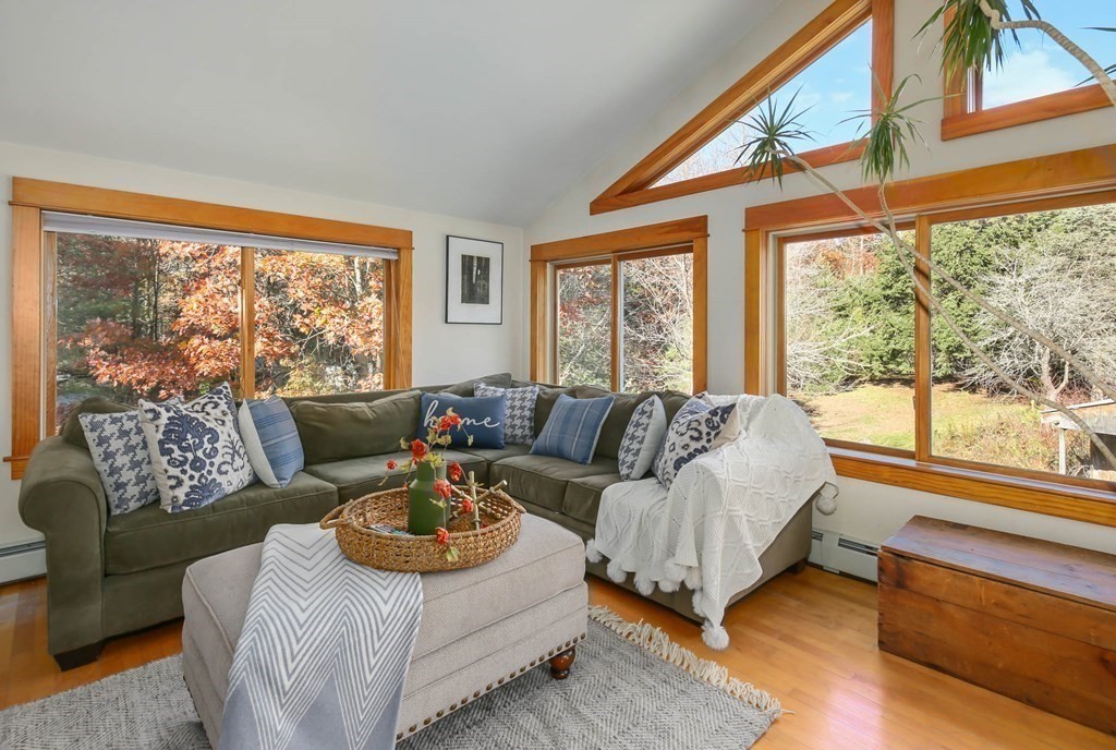 27 Locke Road Rutland, MA 01543 - Photo 6 of 39 a living room with furniture a large window and a rug