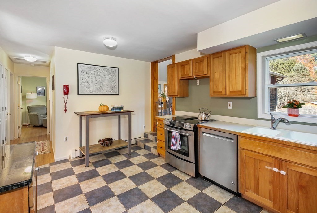 27 Locke Road Rutland, MA 01543 - Photo 9 of 39 a kitchen with stainless steel appliances granite countertop a stove a sink and a refrigerator