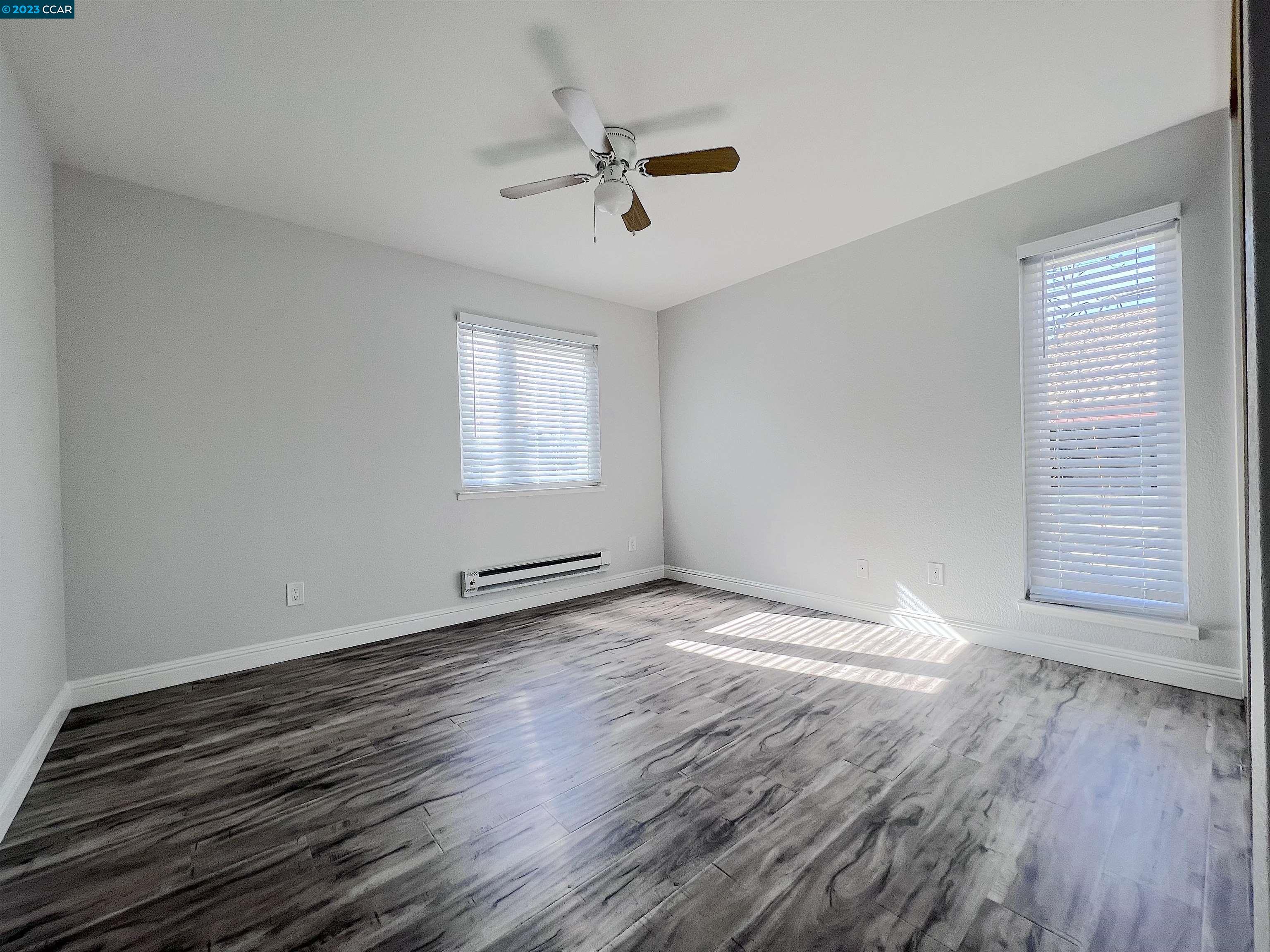 1505 Kirker Pass Road, Unit 239 Concord, CA 94521 - Photo 12 of 22 wooden floor in an empty room with a window