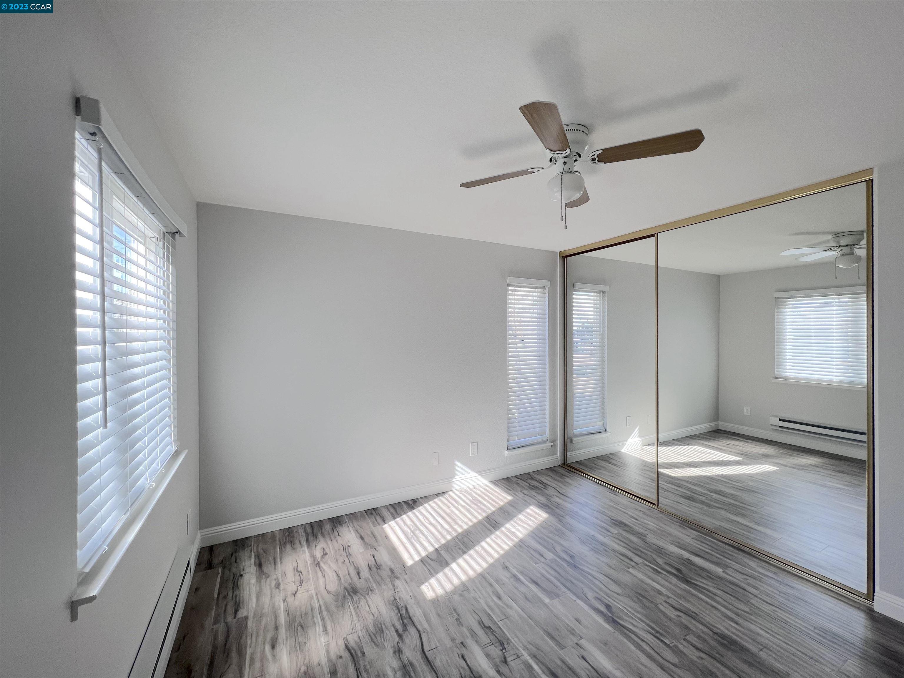 1505 Kirker Pass Road, Unit 239 Concord, CA 94521 - Photo 13 of 22 a view of empty room with wooden floor and fan