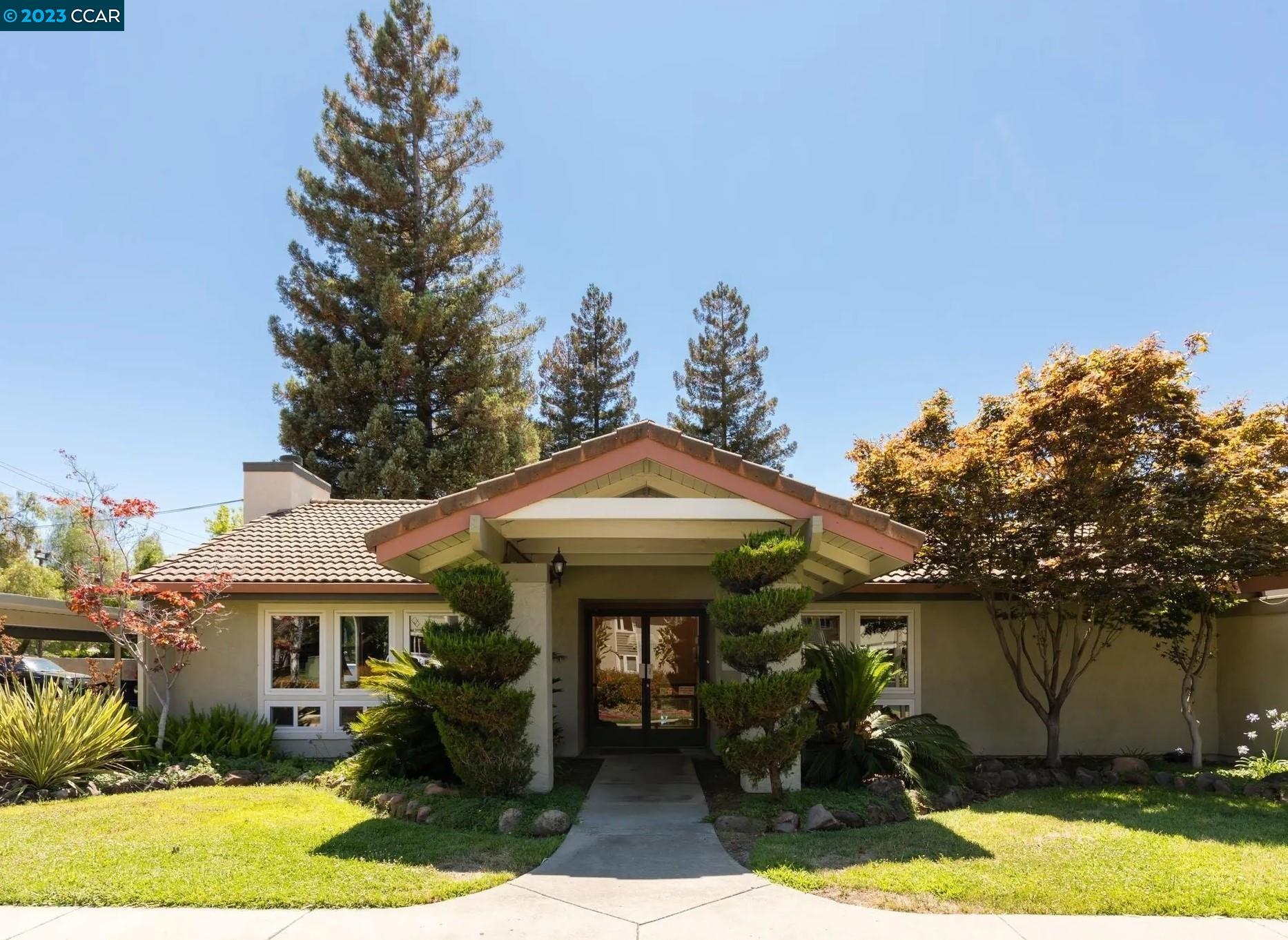 1505 Kirker Pass Road, Unit 239 Concord, CA 94521 - Photo 18 of 22 a front view of a house with garden