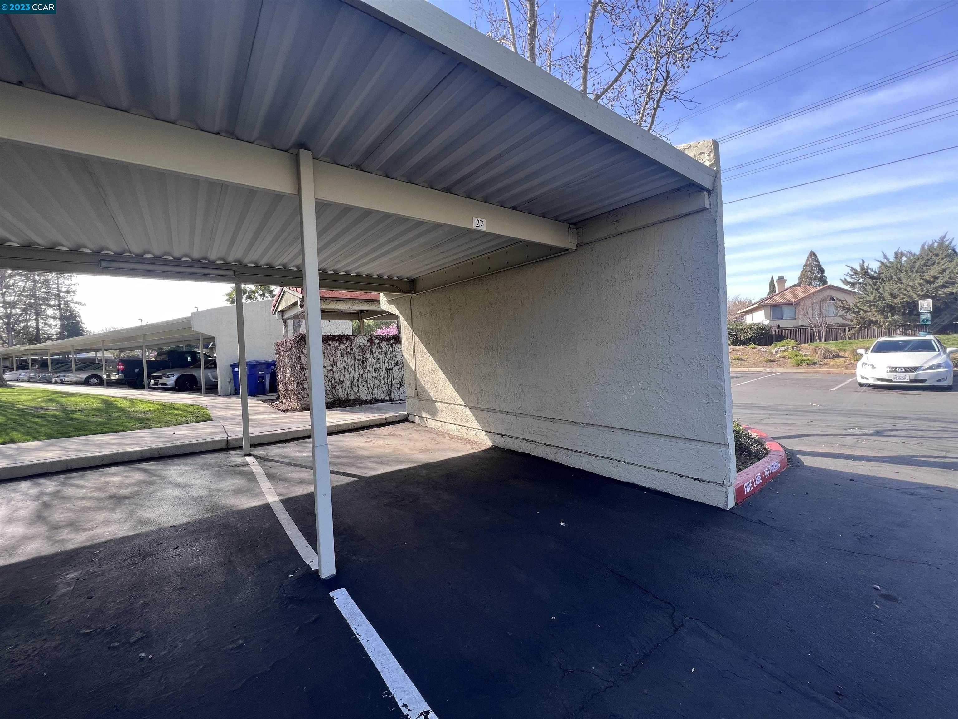 1505 Kirker Pass Road, Unit 239 Concord, CA 94521 - Photo 21 of 22 a view of a patio with table and chairs under an umbrella