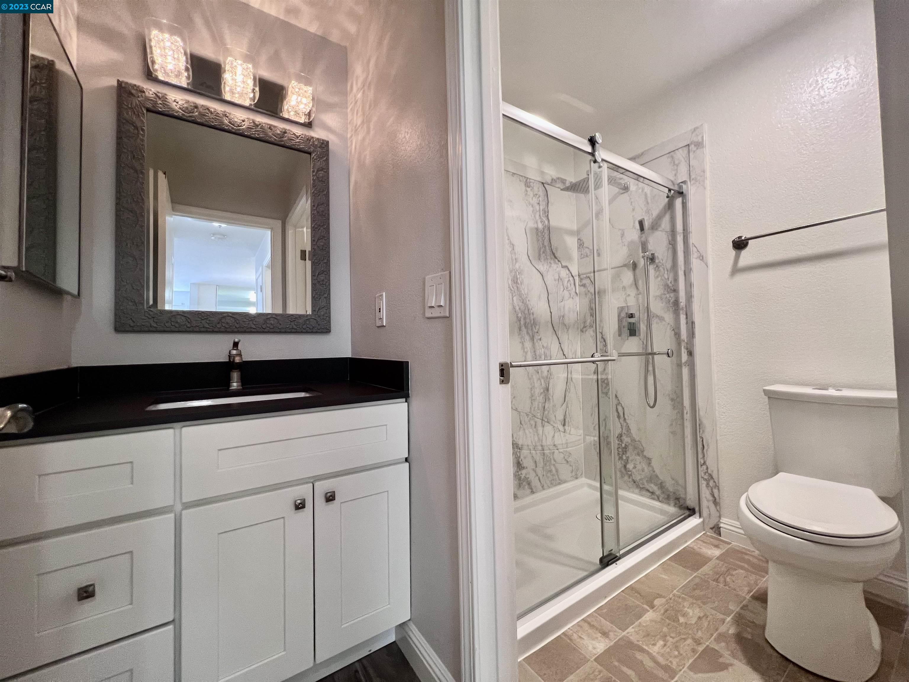 1505 Kirker Pass Road, Unit 239 Concord, CA 94521 - Photo 10 of 22 a bathroom with a sink a toilet and shower
