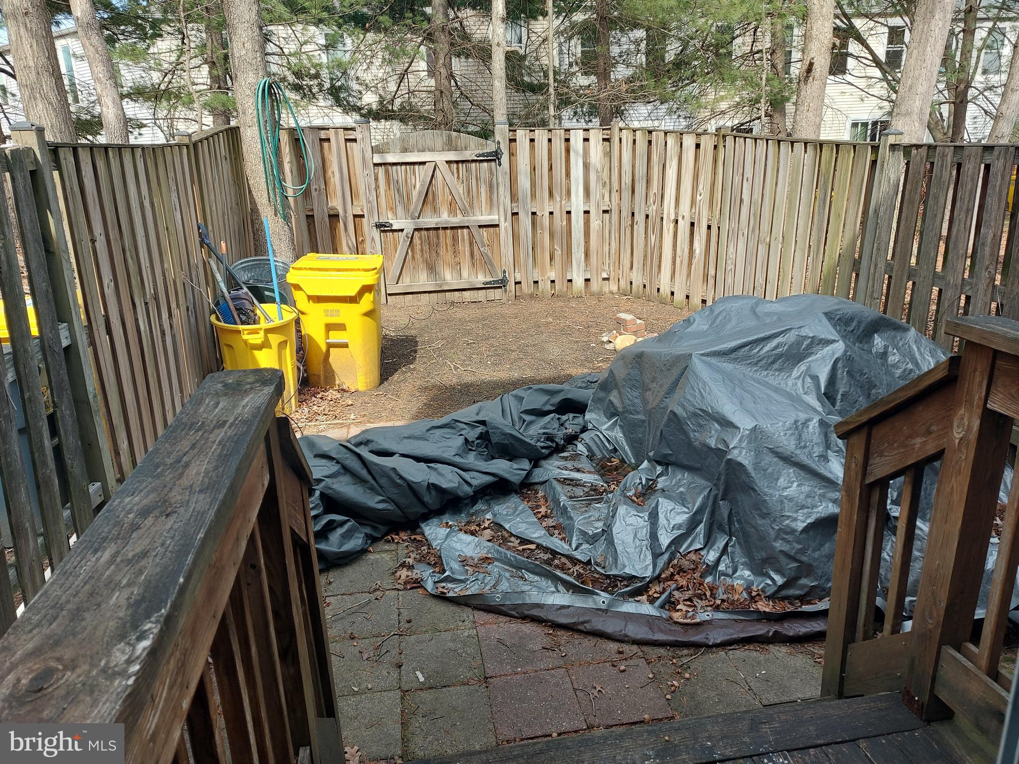 219 Sycamore Ridge Road Laurel, MD 20724 - Photo 4 of 7 a view of a chairs and table in backyard