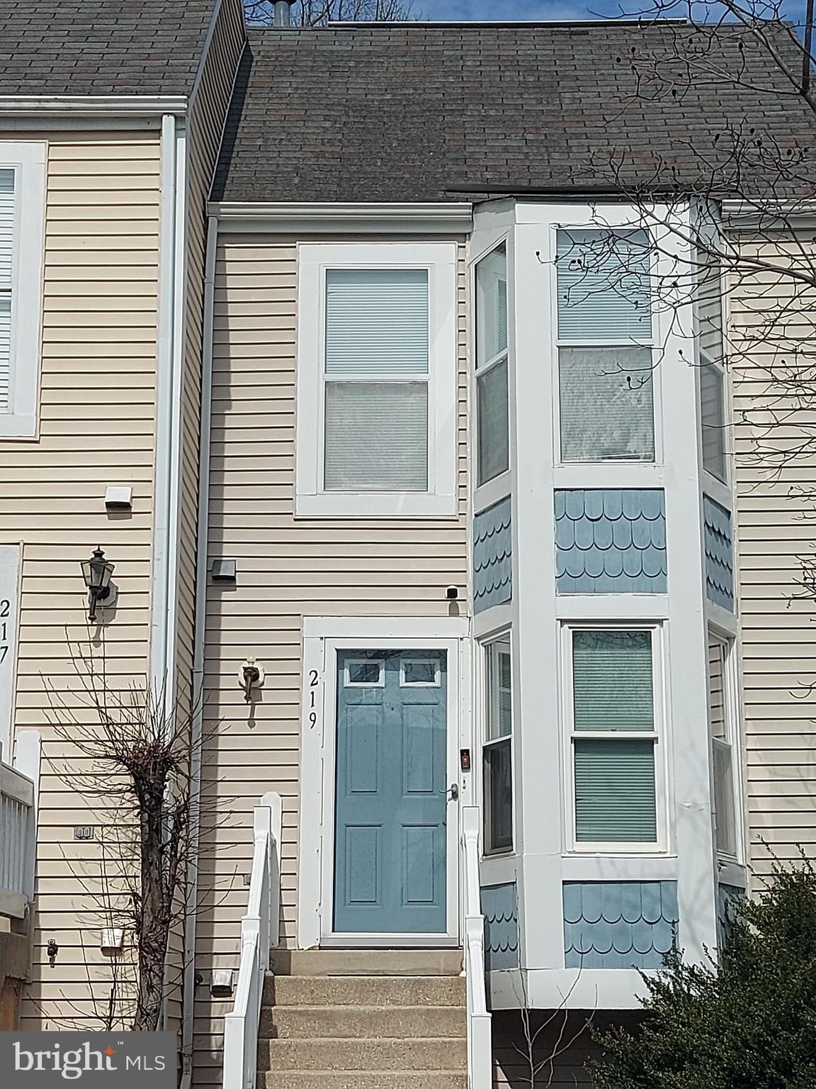 219 Sycamore Ridge Road Laurel, MD 20724 - Photo 7 of 7 a view of a brick house with a door and a window