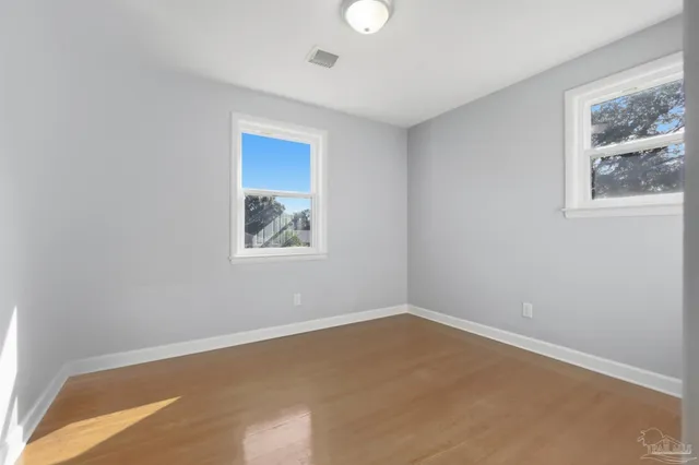 a view of an empty room with a window