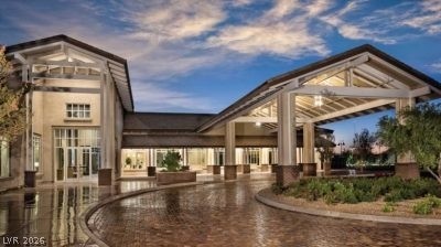 498 Pebble Run Avenue Henderson, NV 89011 - Photo 33 of 47 An inviting portico welcomes you to this distinguished structure with its grand entrance and mature landscaping.