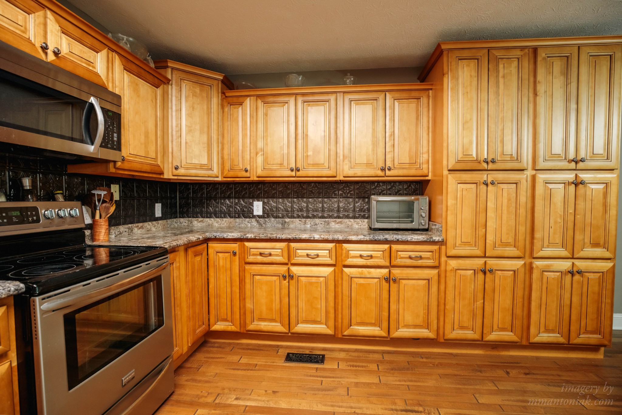 1025 Anderson Road Liberty, TN 37095 - Photo 8 of 41 a kitchen with wooden cabinets and a stove top oven