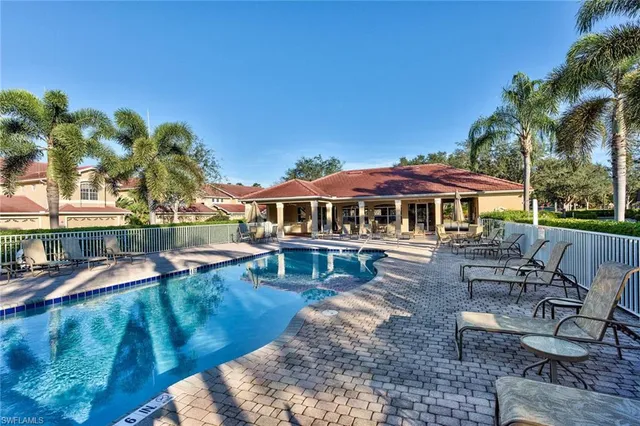 a view of a house with backyard porch and sitting area