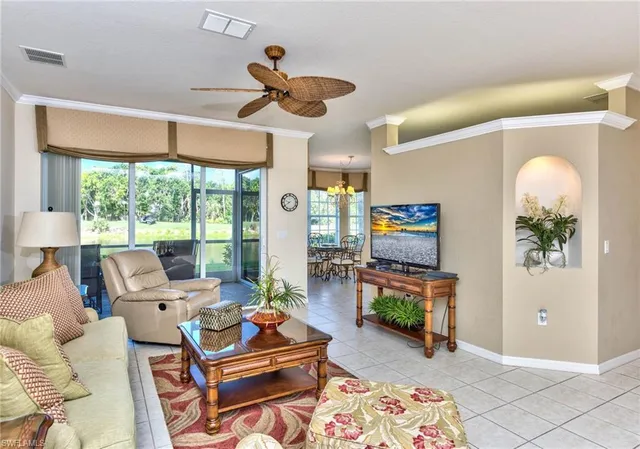 a living room with furniture fireplace and flat screen tv