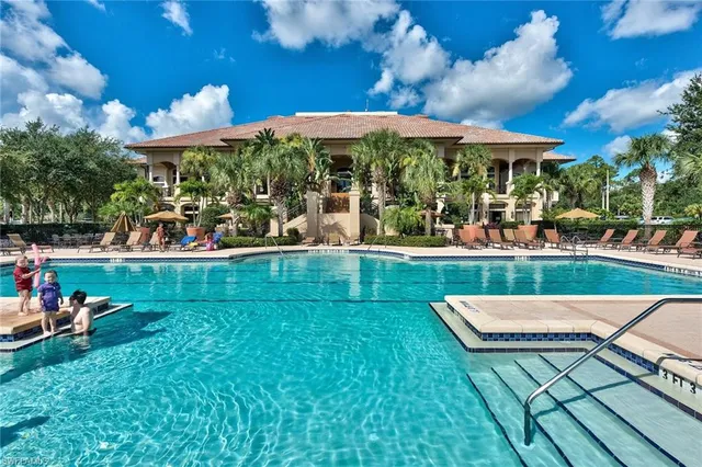 a view of a swimming pool with a patio