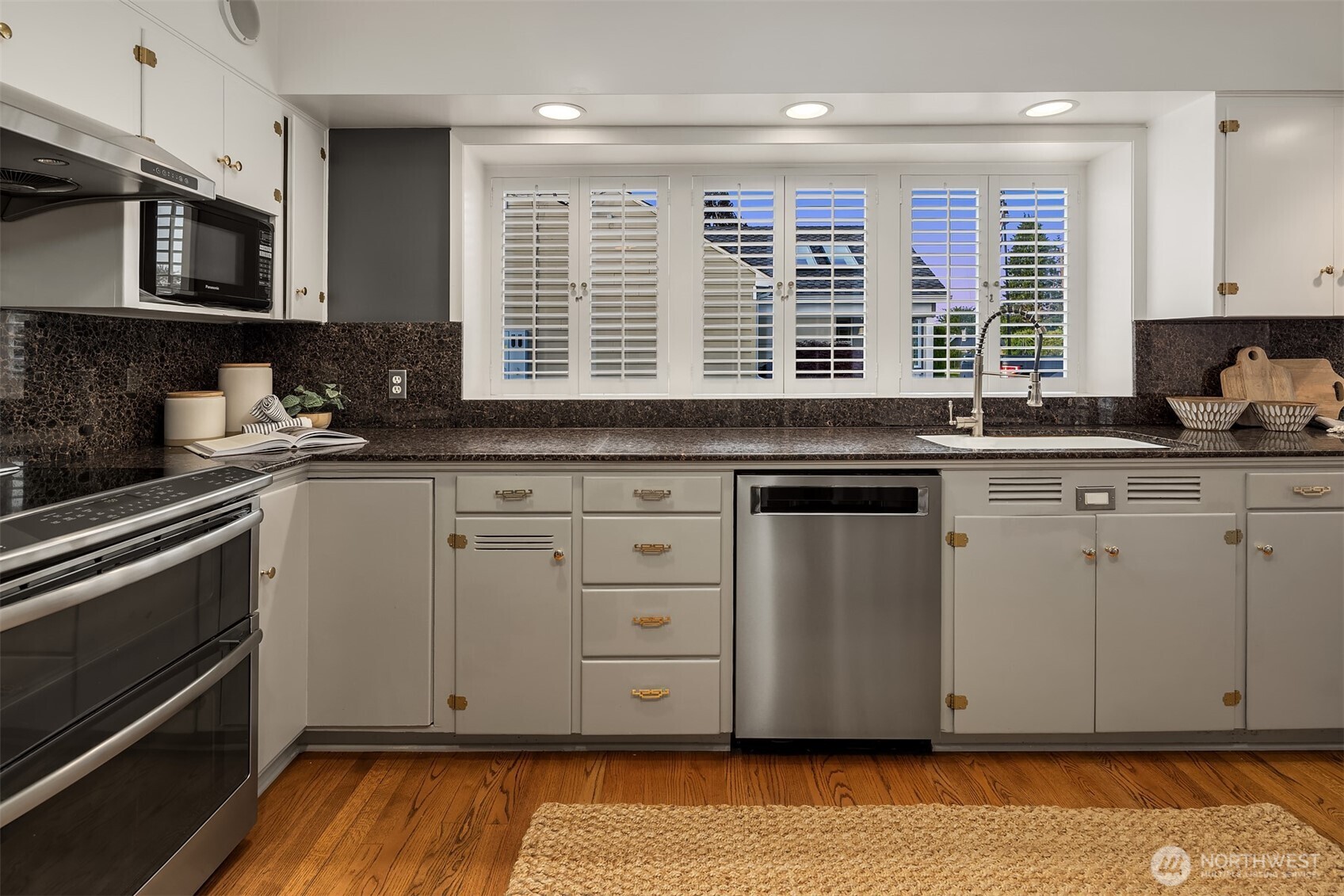 640 Alverson Boulevard Everett, WA 98201 - Photo 17 of 40 a kitchen with granite countertop a sink cabinets stainless steel appliances and a window