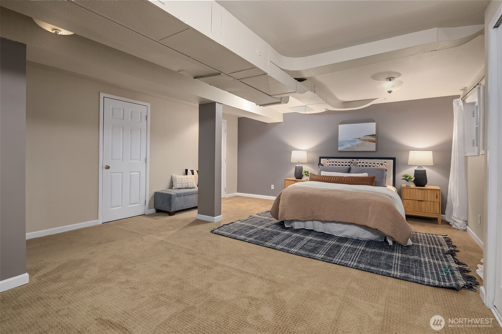 640 Alverson Boulevard Everett, WA 98201 - Photo 36 of 40 a bedroom with a large bed and a chandelier