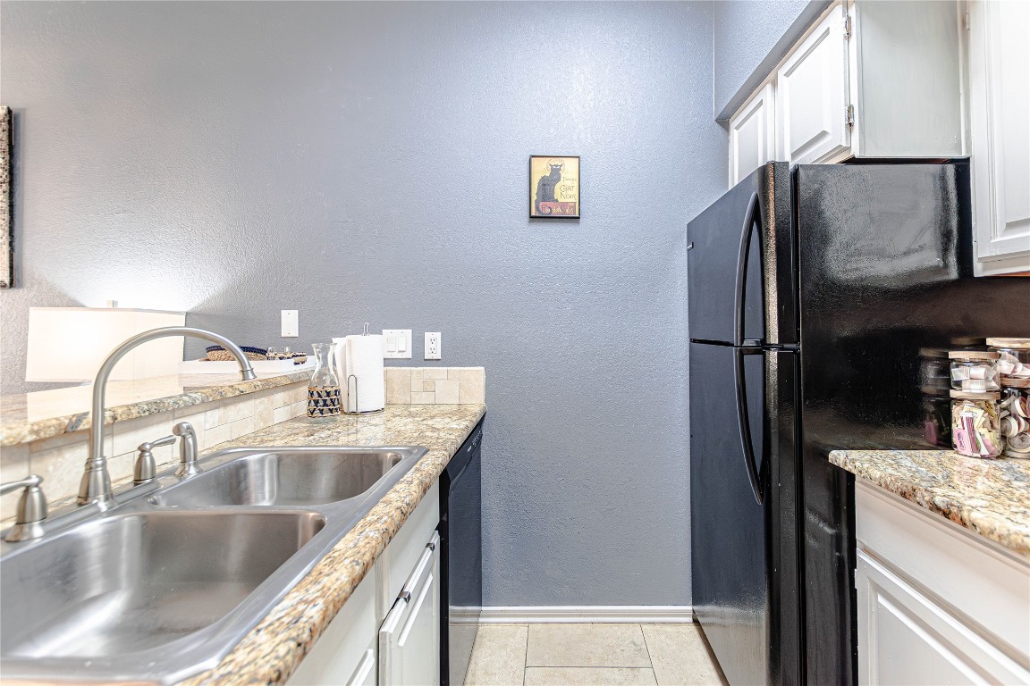 3404 American Drive, Unit 3226 Lago Vista, TX 78645 - Photo 15 of 40 a kitchen with a sink and refrigerator