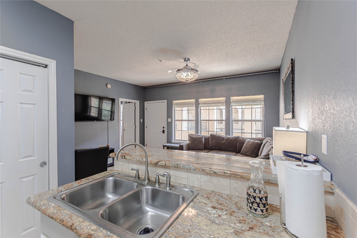 3404 American Drive, Unit 3226 Lago Vista, TX 78645 - Photo 17 of 40 a large bedroom with a bed and wooden floor