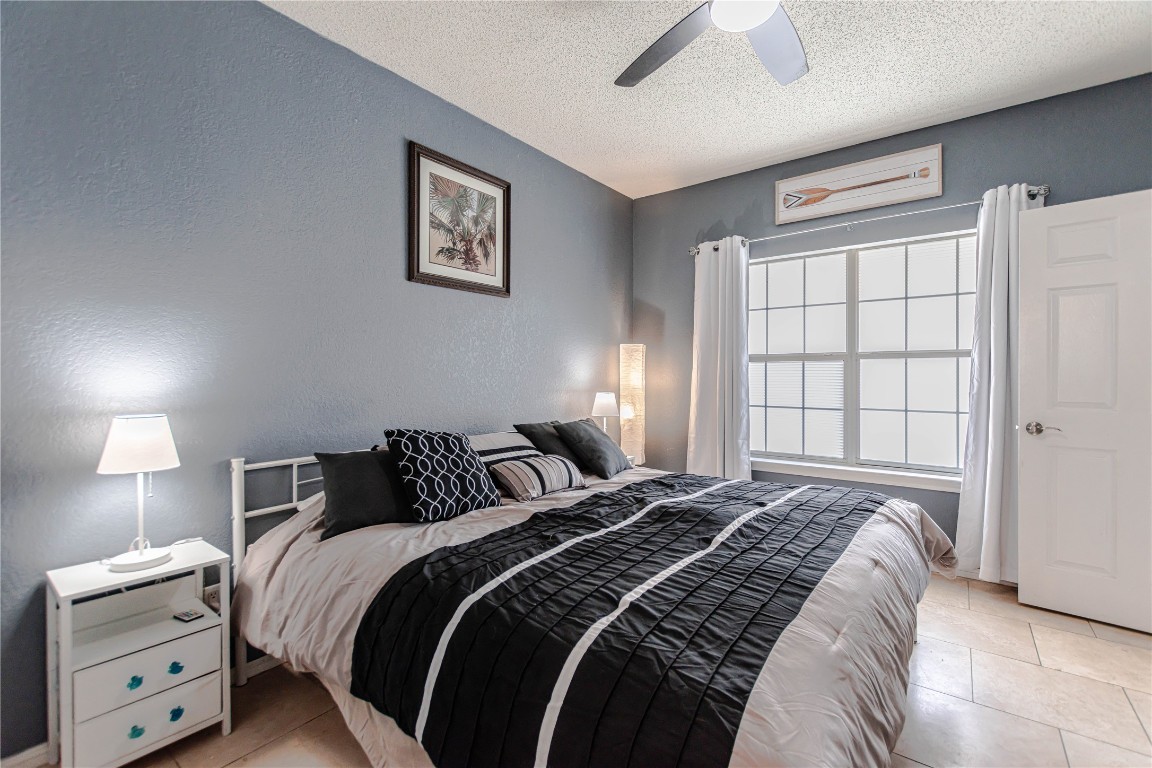 3404 American Drive, Unit 3226 Lago Vista, TX 78645 - Photo 19 of 40 a bedroom with a bed and a window