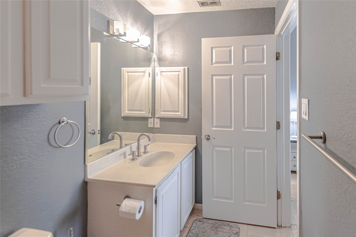 3404 American Drive, Unit 3226 Lago Vista, TX 78645 - Photo 20 of 40 a bathroom with a sink and a mirror