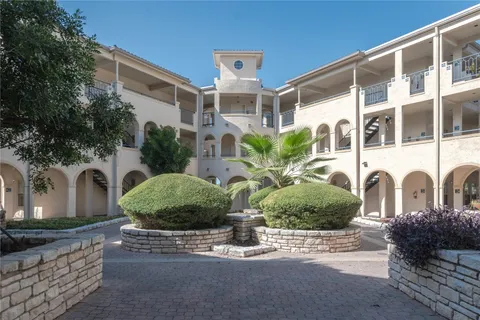 a front view of a building with garden