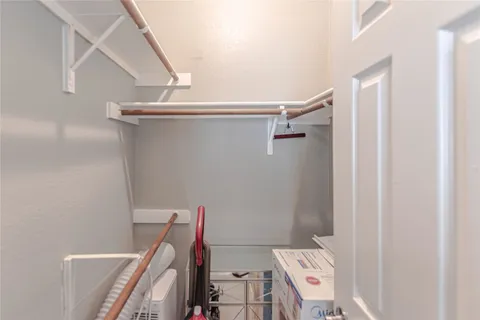 a view of storage and utility room with racks on the wall