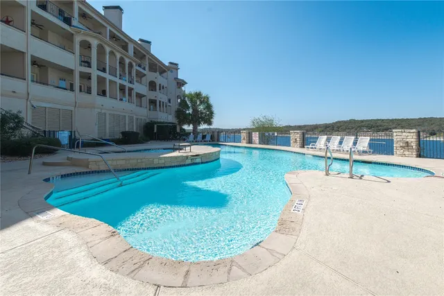 a view of a swimming pool with a garden