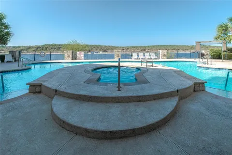 a view of a swimming pool with a lake