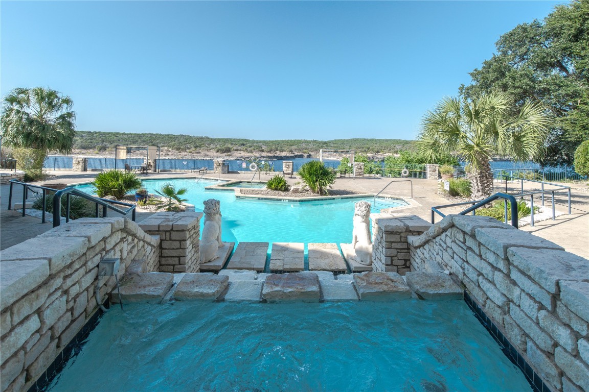 3404 American Drive, Unit 3226 Lago Vista, TX 78645 - Photo 26 of 40 a view of swimming pool outdoor seating and city view