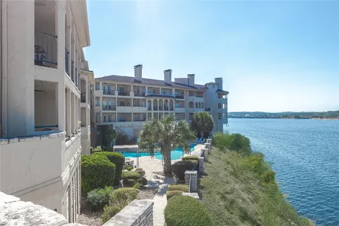 a view of building with yard and staircase