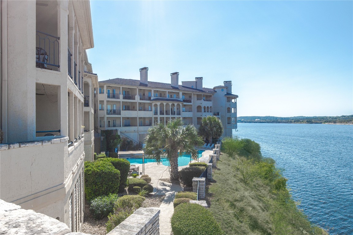 3404 American Drive, Unit 3226 Lago Vista, TX 78645 - Photo 27 of 40 a view of building with yard and staircase