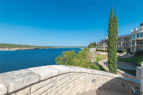 a view of a lake with a building in the background