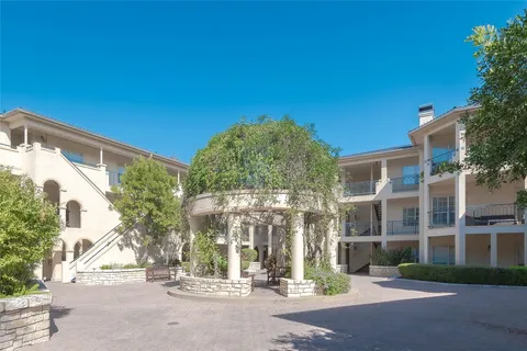 a view of a building with a street