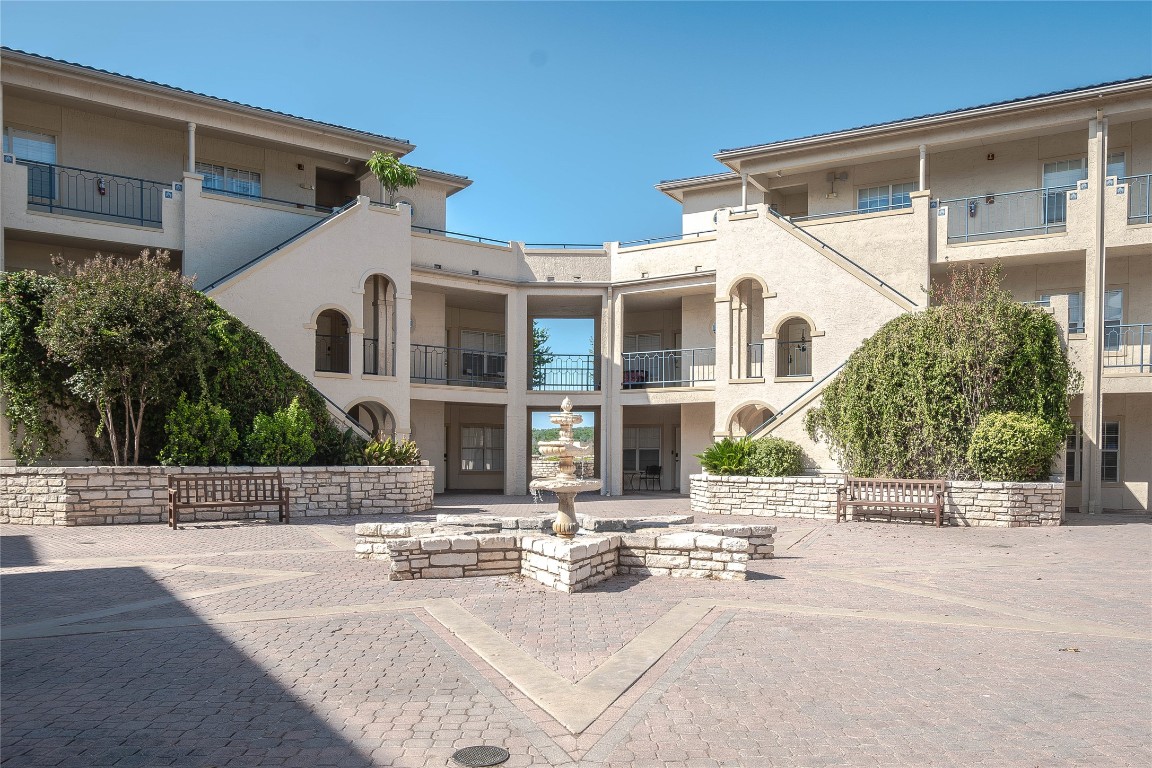 3404 American Drive, Unit 3226 Lago Vista, TX 78645 - Photo 4 of 40 a front view of a house with a yard