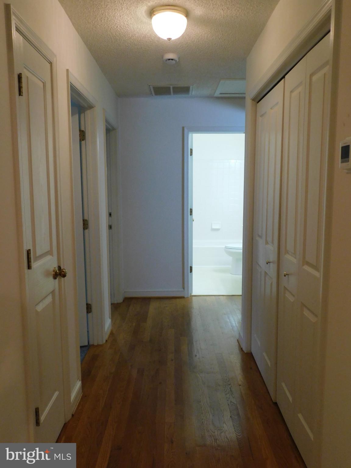 108 Senseny Glen Drive Winchester, VA 22602 - Photo 11 of 24 a view of a hallway with wooden floor