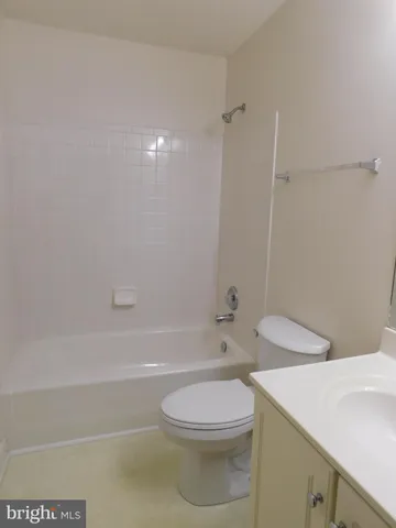 a bathroom with a toilet a sink and bathtub