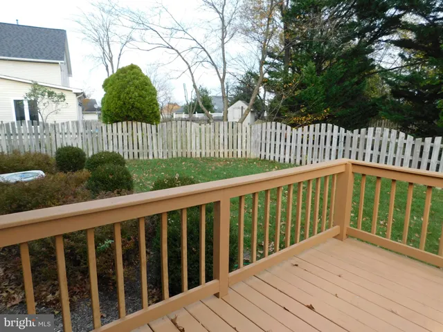 a view of wooden fence and trees