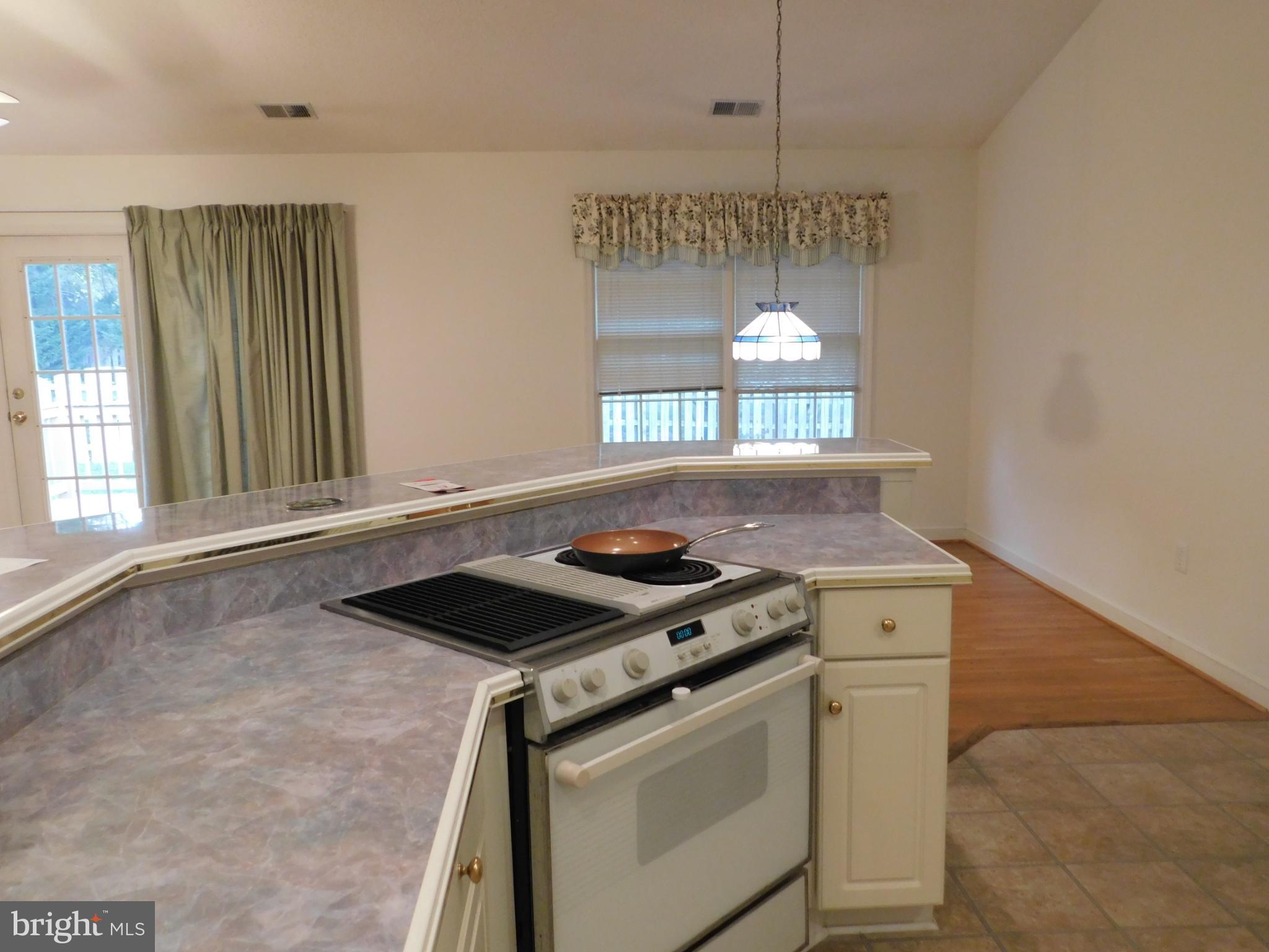 108 Senseny Glen Drive Winchester, VA 22602 - Photo 7 of 24 a kitchen with a stove and a window