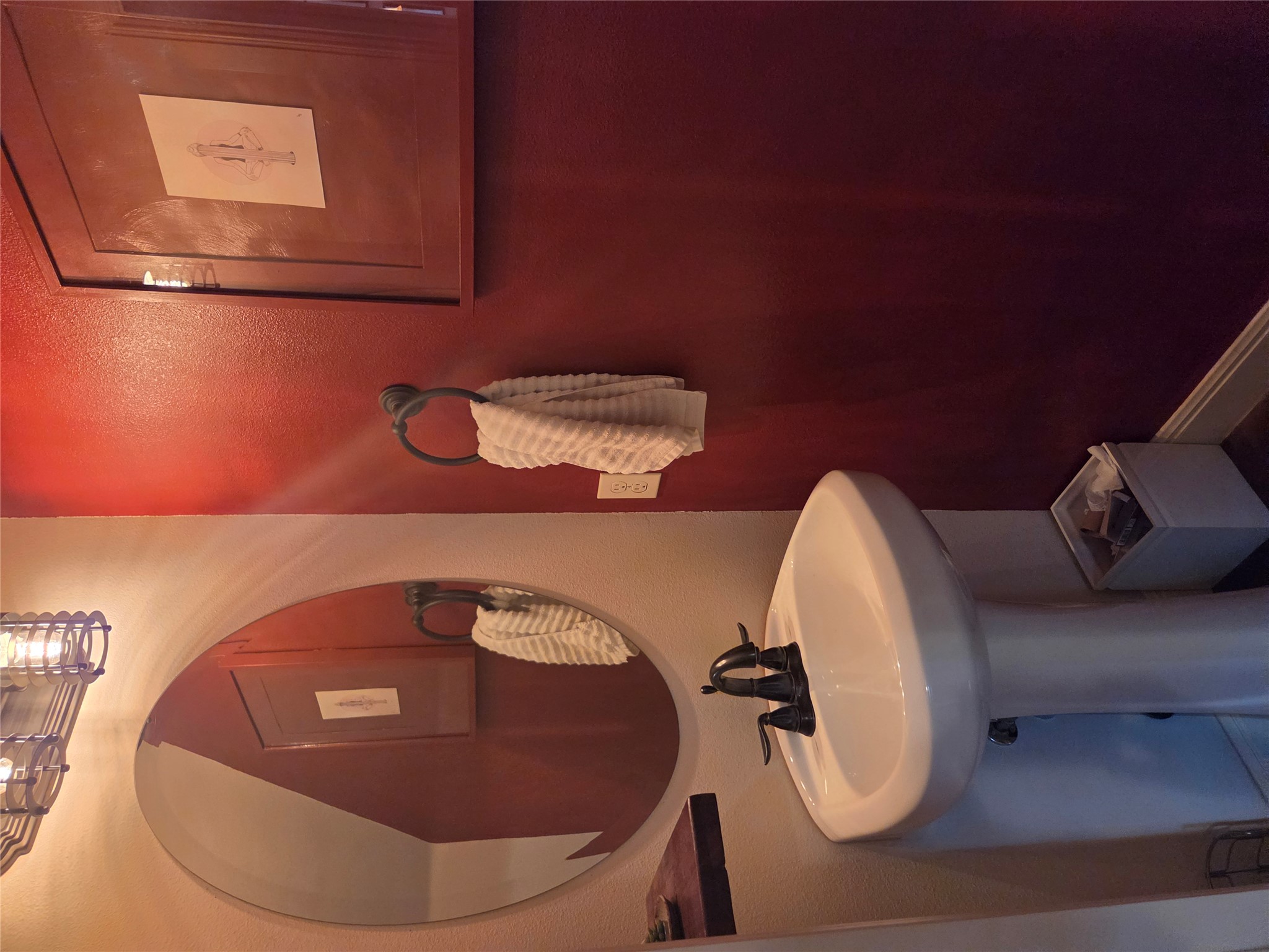 408 West Croslin Street Austin, TX 78752 - Photo 14 of 29 A well-appointed powder room features a pedestal sink and modern lighting.
